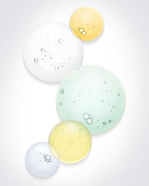 Abstract shot of translucent liquid or gel bubbles in various colors and sizes against a plain white background, beauty product photography.