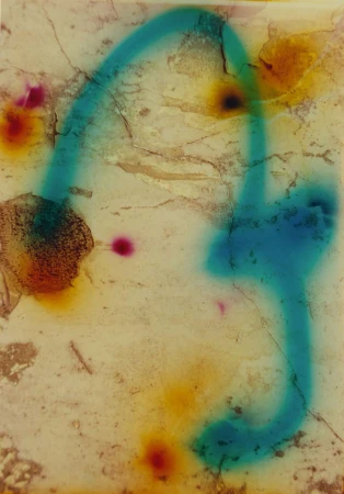 Abstract image featuring cracked and weathered surface with faded blue and yellow hues, and colorful paint spray.