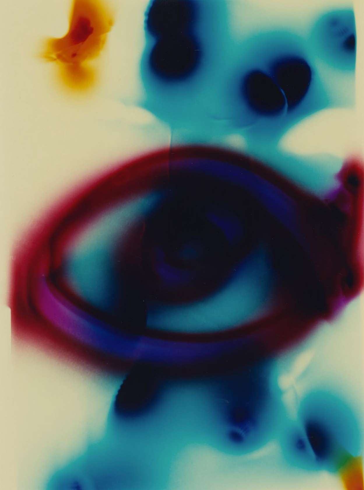 Abstract image with blended swirls of red, purple, and blue converging on a cream-colored background with fluid shapes.