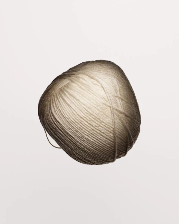 Close-up photo of a single ball of yarn in a soft neutral color, perfect for knitting or crochet projects with a smooth texture.