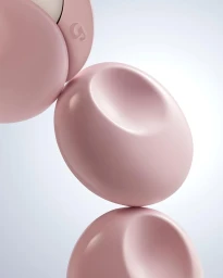 Glossy pink rounded cosmetic packaging objects stacked vertically on a clean white background