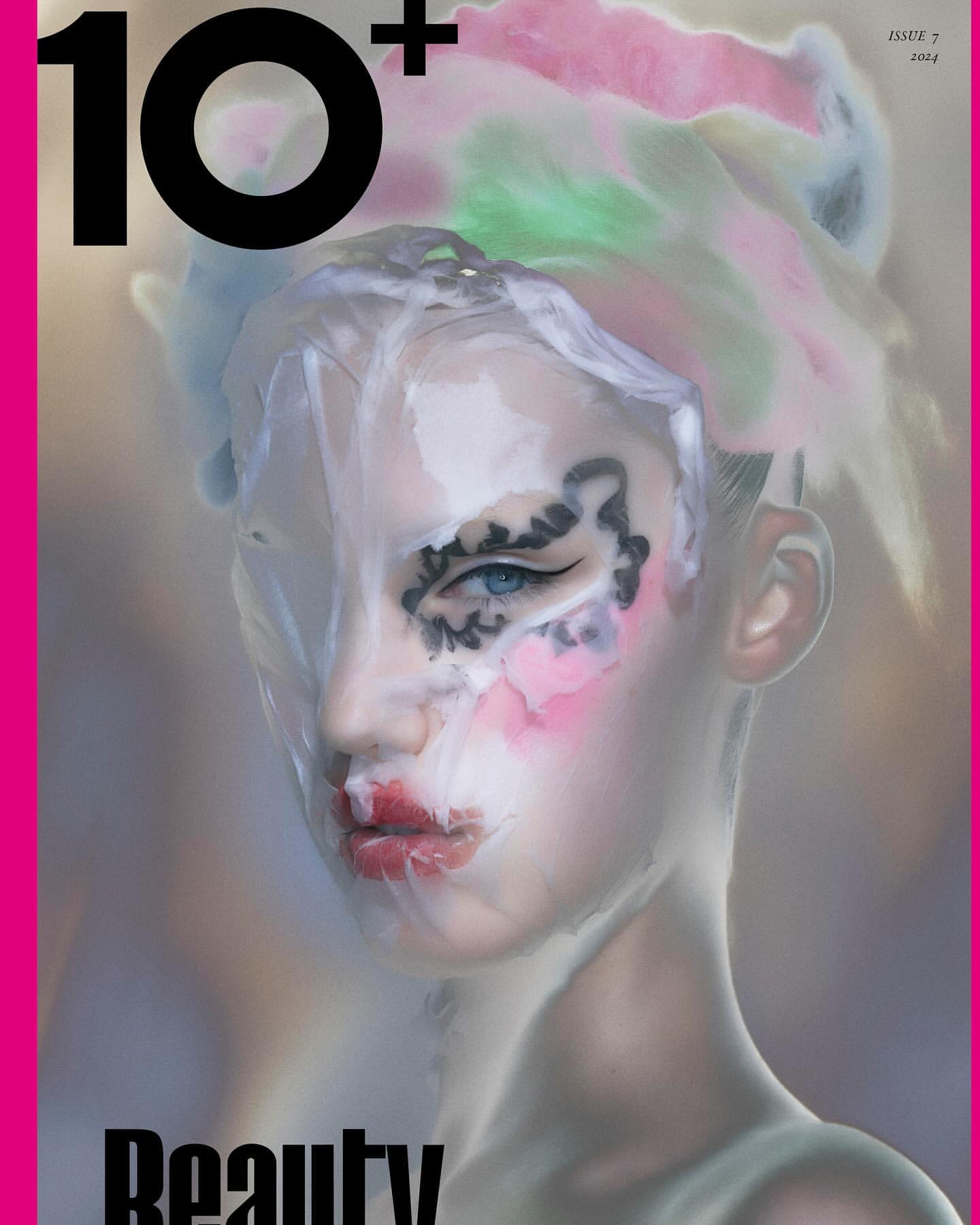 Magazine cover featuring a person with face makeup and decorative head covering, artistic beauty portrait with beauty and fashion elements.