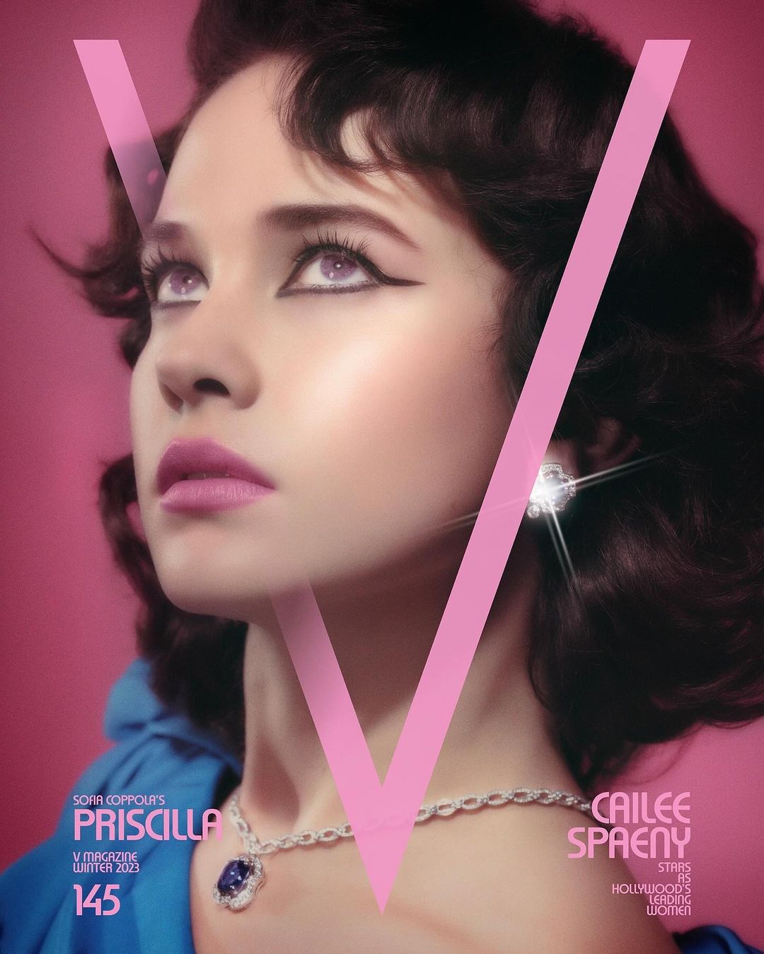 V Magazine cover featuring Cailee Spaeny with dark curly hair, purple makeup, and a diamond necklace, against a pink backdrop.