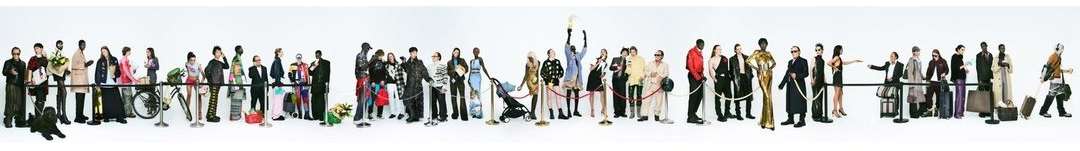 Diverse group of people standing behind ropes in a long line, some with luggage and a stroller, against a clean white background.