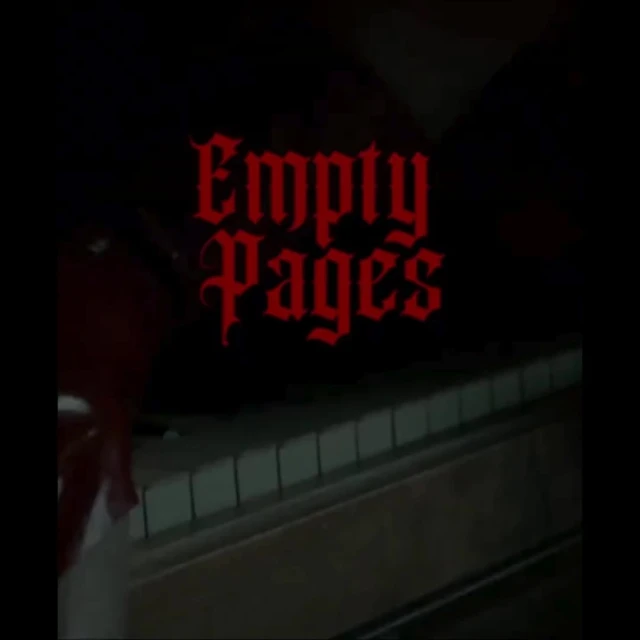 Piano keys visible in a dark setting with the red text “Empty Pages” overlayed on the image, creating a moody and musical atmosphere.