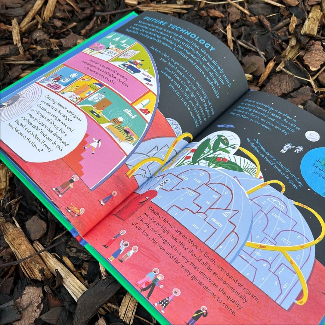 Open book displaying illustrations of futuristic homes and technology, set against a wood chip background.