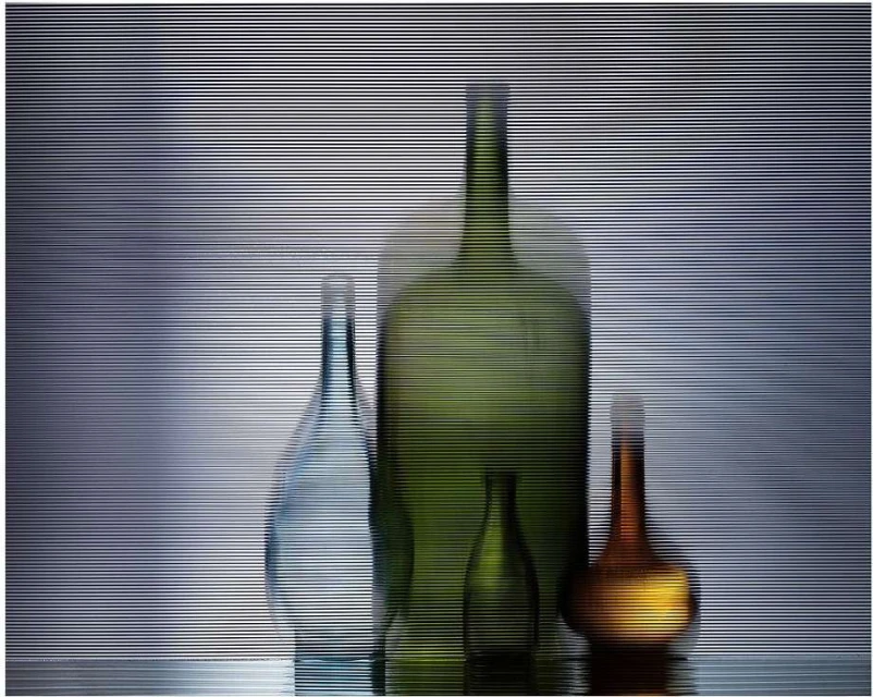 Still life featuring an arrangement of glass bottles in varying shapes and colors, captured with a blurred horizontal stripe effect.