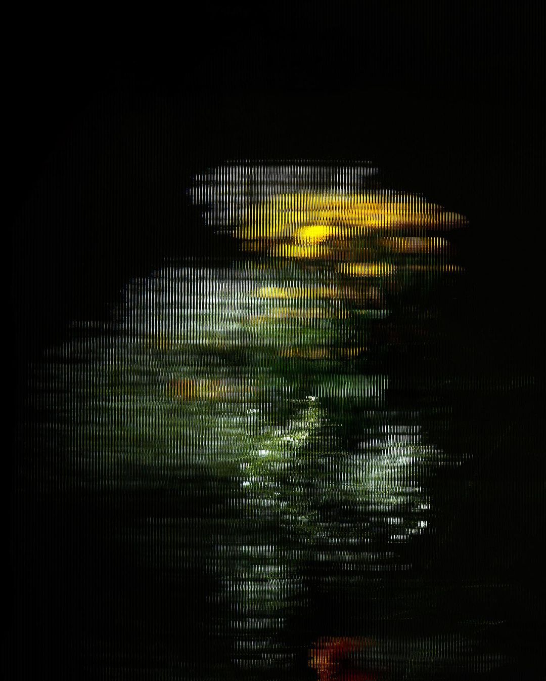 Abstract composition of blurred lights and reflections on a dark surface, resembling water, with a dark black background, artistic and moody.