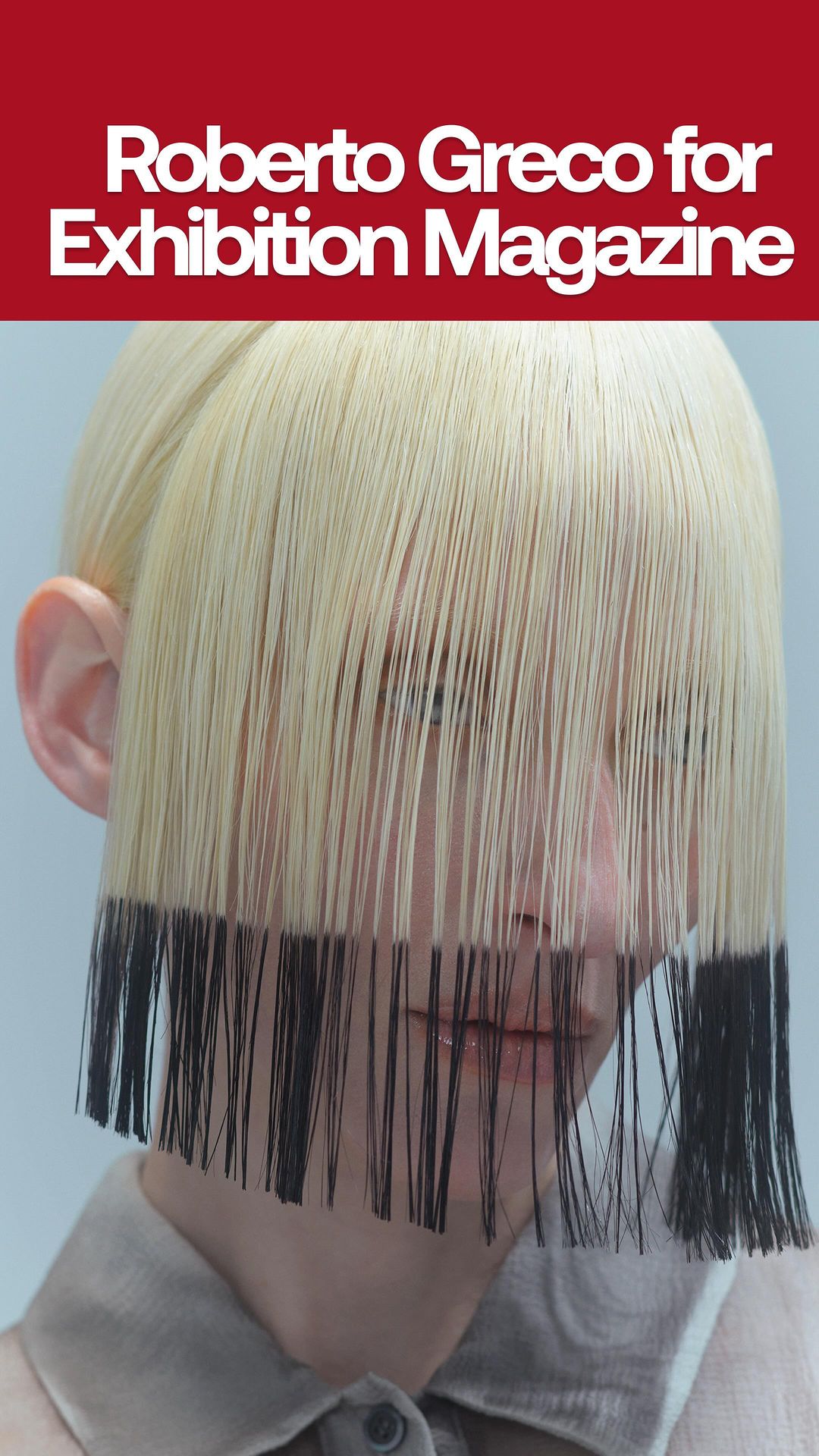 Face framed by blonde hair with black tips in a studio shot for Exhibition Magazine, showcasing a unique beauty and fashion statement.