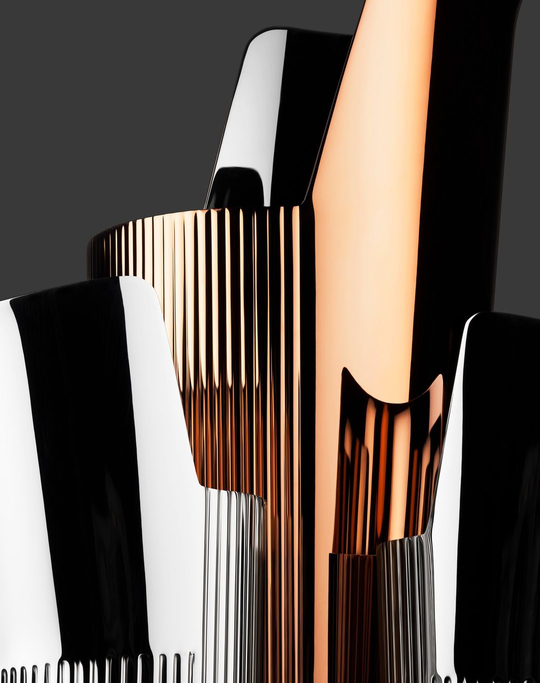 Abstract product shot featuring a collection of glossy, striped, and corrugated metallic structures in copper, silver, black, and white tones.