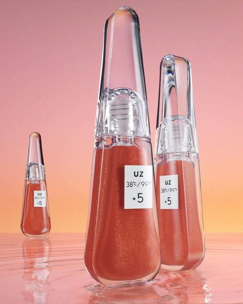 Three clear bottles of liquid makeup on a reflective surface, against a peach and yellow background, product photography.