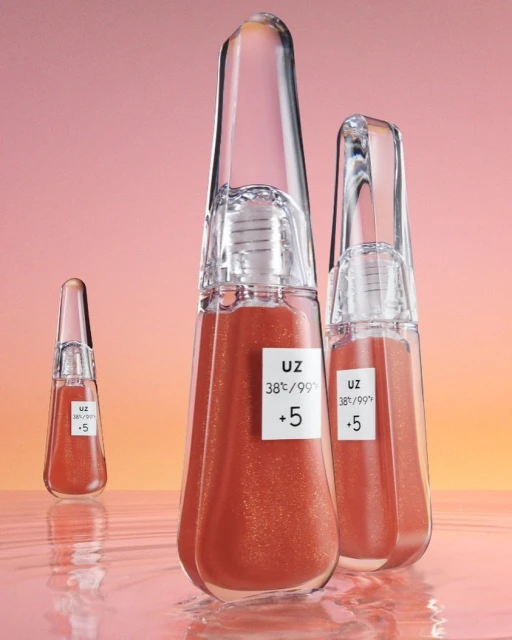 Three clear bottles of liquid makeup on a reflective surface, against a peach and yellow background, product photography.