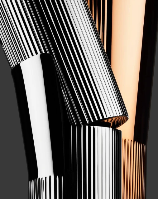 Abstract close-up of modern black, white, and gold cosmetic tubes with vertical lines. Beauty and cosmetic product photography.