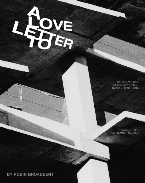 Abstract black and white architecture with stark white text overlay, reading 'A Love Letter' against structural beams and concrete.