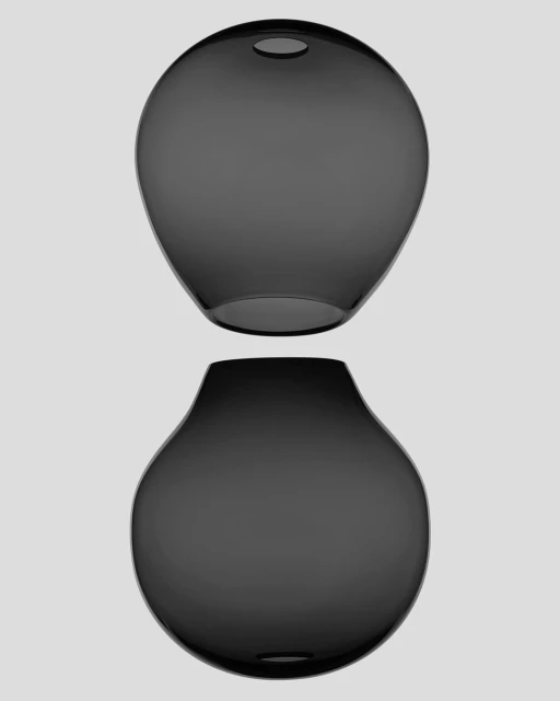 Two translucent, dark glass vases, one floating slightly above the other, showcase modern design against a neutral background.
