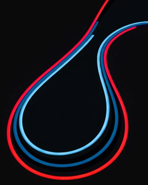 Abstract image of three glowing, curved light lines in red and blue against a black background, creating a dynamic visual pattern.