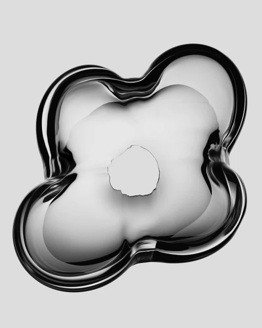 Shiny reflective sculpture with a rounded abstract floral form against a light gray backdrop creates a modern art aesthetic.