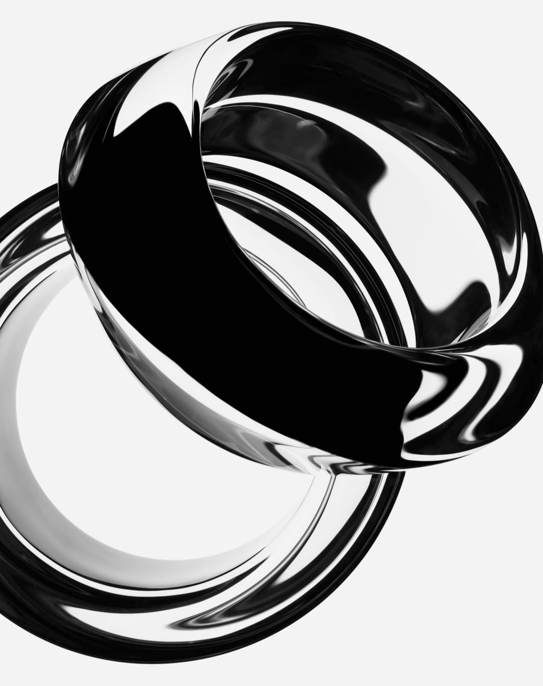 Abstract composition with two interlocking reflective rings, one silver and one black, against a bright white background.