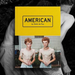 Book cover titled AMERICAN by Robin de Puy featuring two shirtless young men with red hair standing outdoors