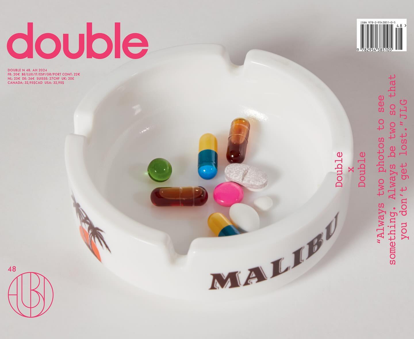 White Malibu ashtray filled with colorful pills, arranged on a white surface. The word 'double' and other text are visible.