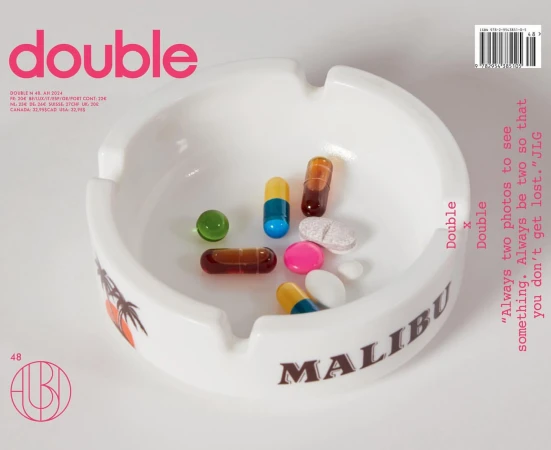 White Malibu ashtray filled with colorful pills, arranged on a white surface. The word 'double' and other text are visible.