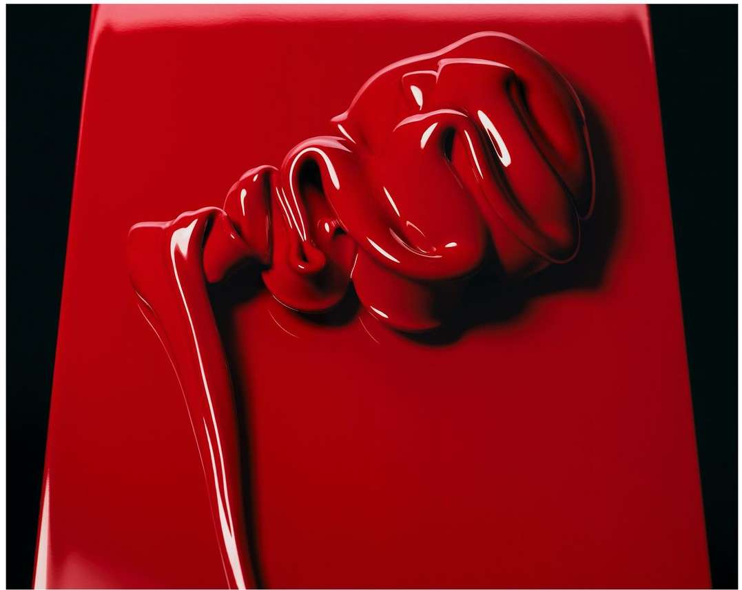 Close-up of thick, glossy red cream or paint swirled on a red surface against a dark background. Beauty product or art concept.