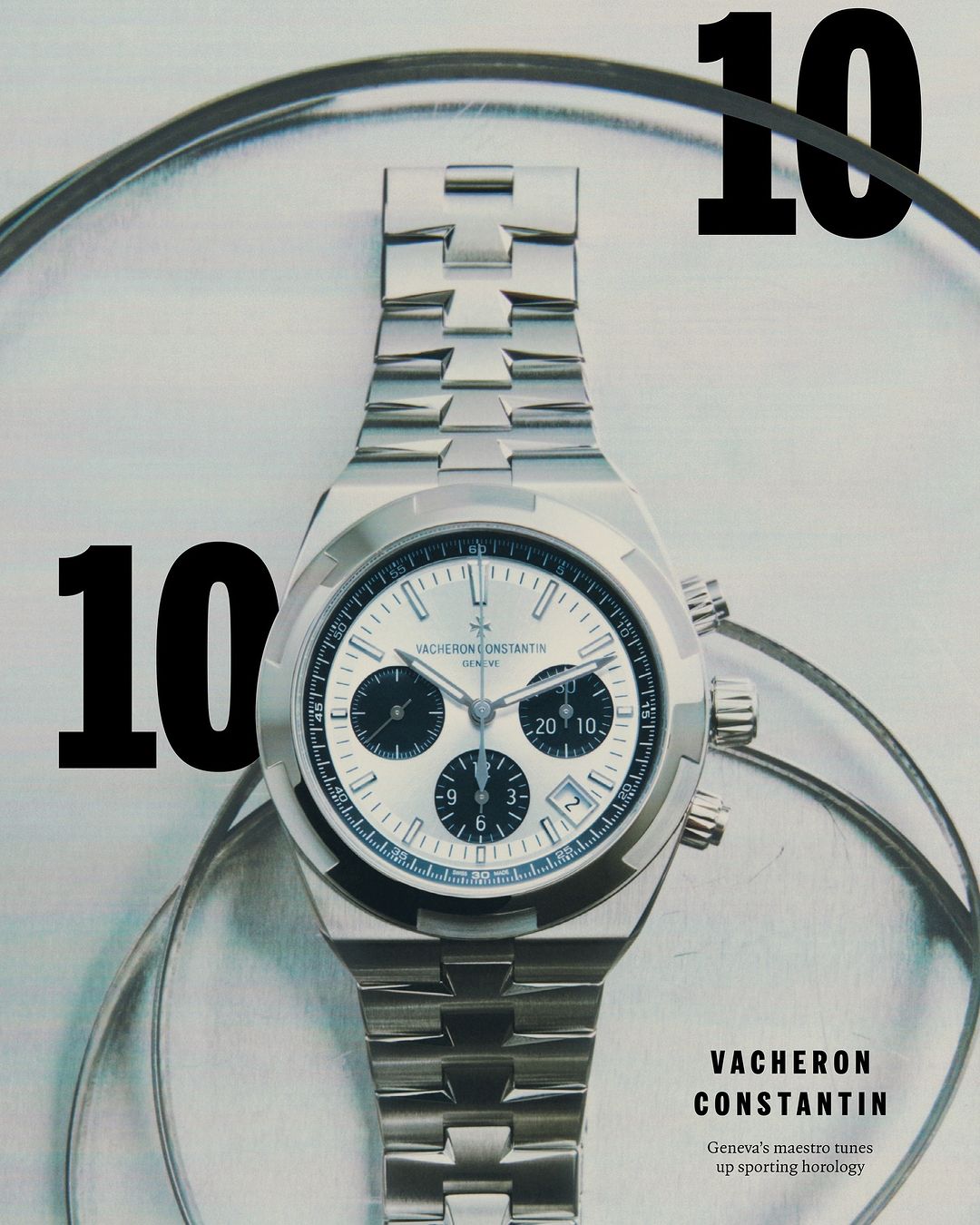 Silver Vacheron Constantin wristwatch with silver bracelet against a light grey backdrop with a large numeral ten in black