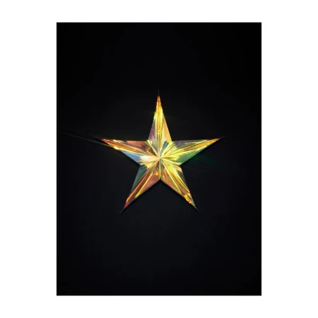 Iridescent star-shaped decoration on a black backdrop, featuring a reflective surface with hues of gold, green, and purple.