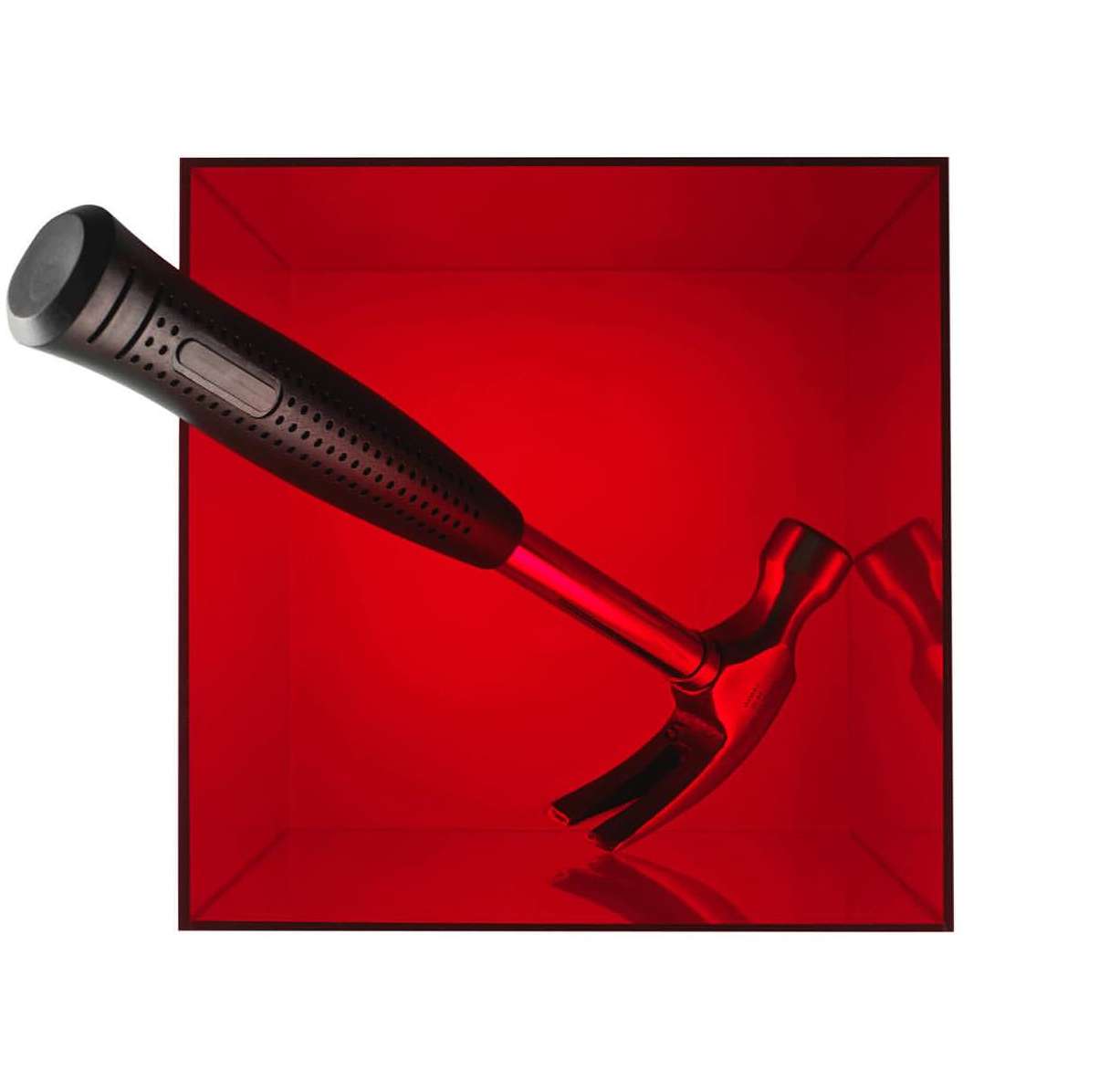 Angled view of a claw hammer featuring a black handle and a metallic red head, set against a deep red square background.