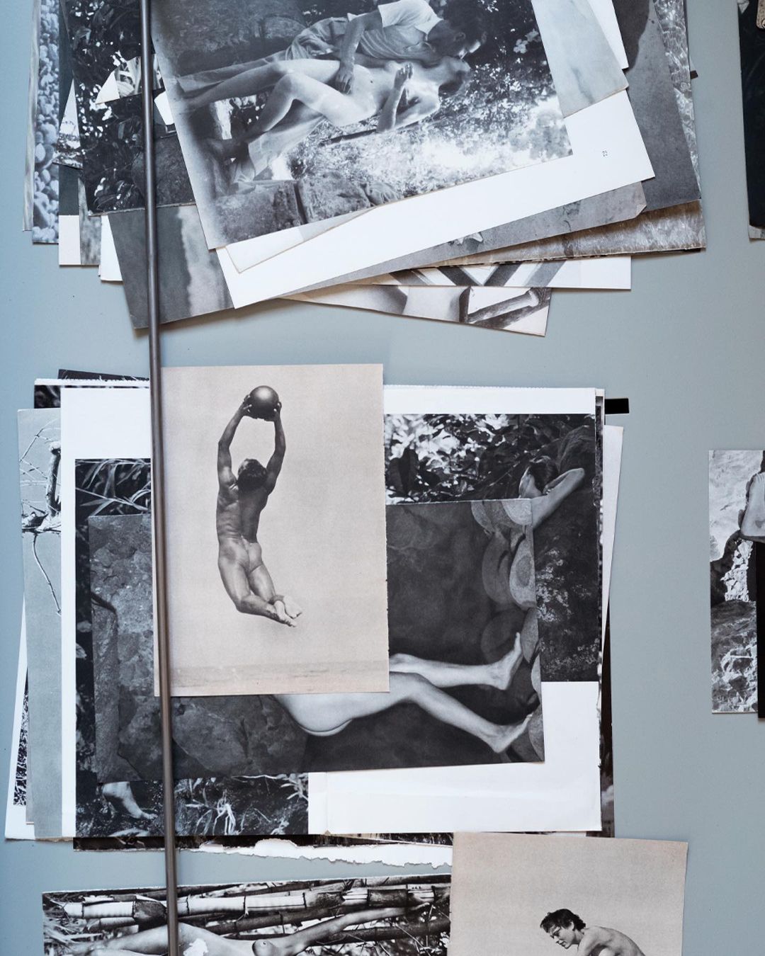 Collage of black and white photographs showcasing male figures in varied poses and settings, creating an artistic visual mosaic.