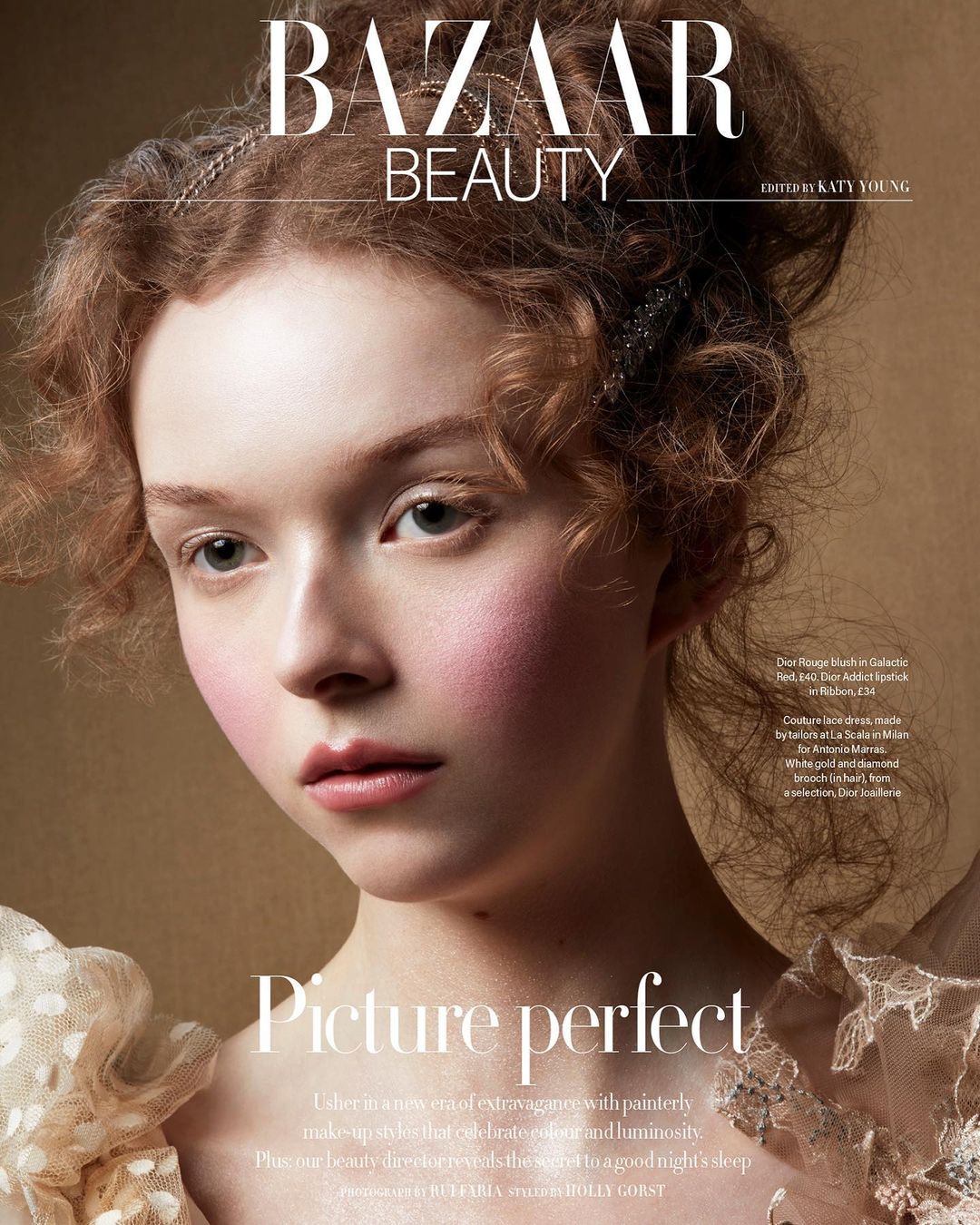 Close-up beauty portrait of a fair-skinned female model with intricate updo and pink blush by photographer Rui Faria.