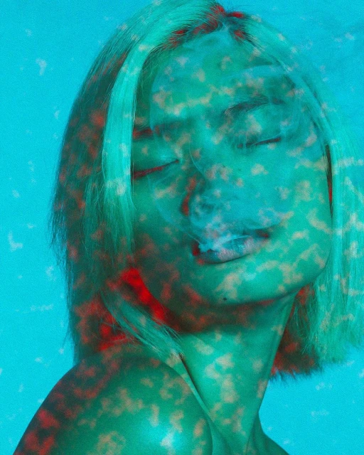 Portrait of an adult female with short blond hair exhaling vapor, with a hazy blue filter and a red and brown patterned overlay.