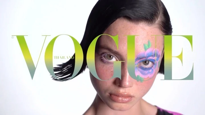 Vogue Thailand cover featuring a person with painted floral makeup on a white background with stylized branding and high-key lighting.