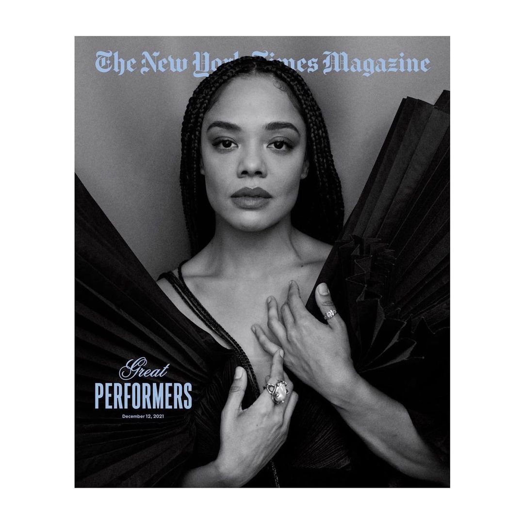 Black and white portrait of actress Tessa Thompson on The New York Times Magazine cover. She poses in a black dress and jewelry.