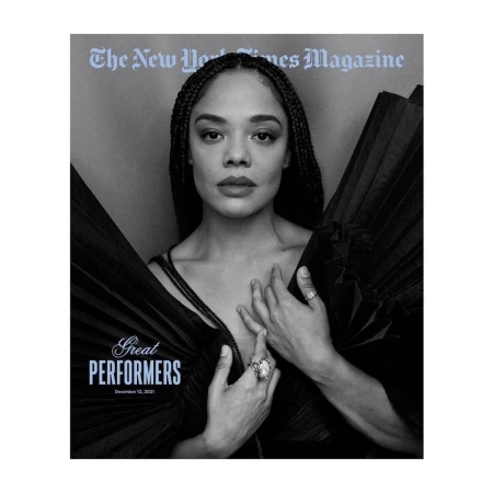 Black and white portrait of actress Tessa Thompson on The New York Times Magazine cover. She poses in a black dress and jewelry.