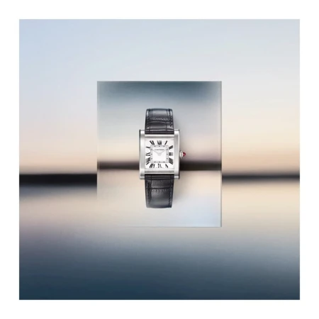 Elevated product shot of a silver and black rectangular wristwatch with a leather band against a gradient blue background.