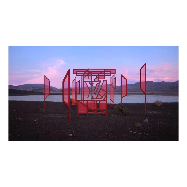Abstract red metal art installation in a barren landscape with a lake and mountains under a twilight sky, creating a surreal scene.