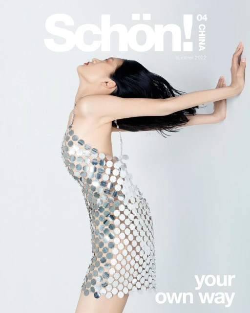Elegant woman in a shimmering dress poses gracefully against a plain background, featured on the cover of Schön! China Summer 2022.