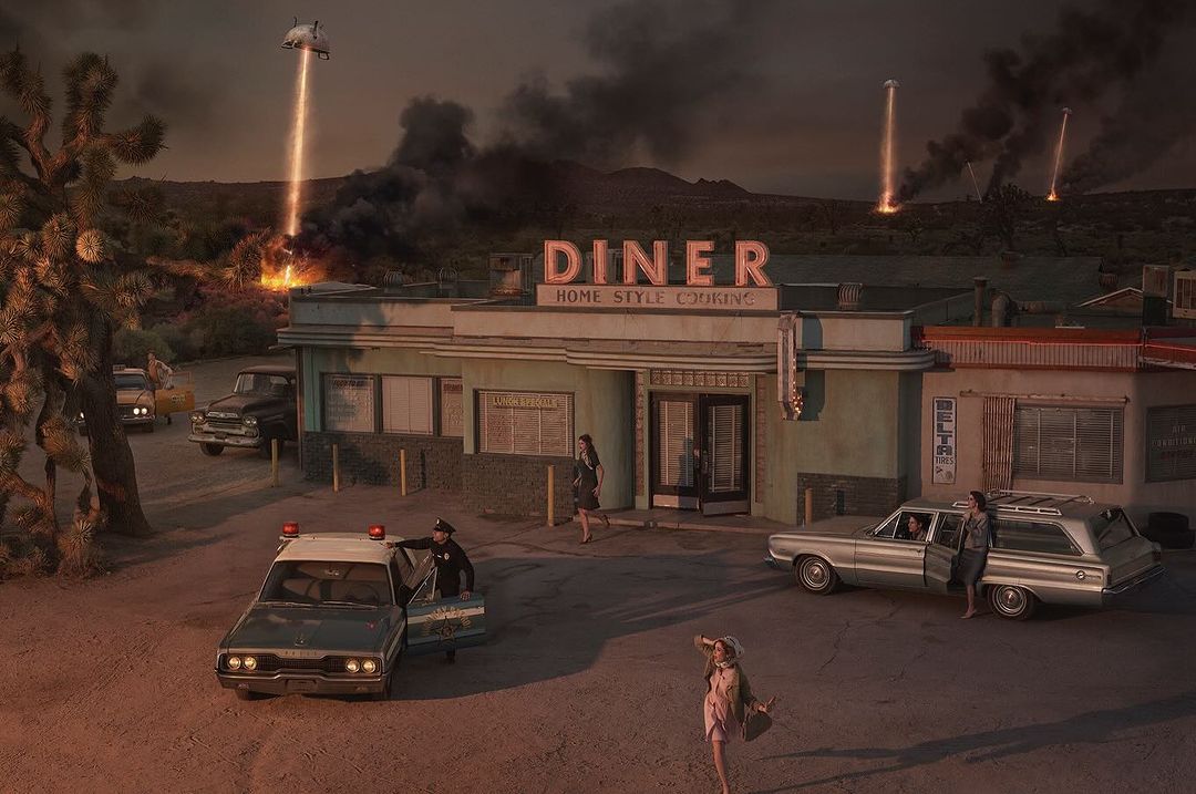 Retro diner scene with classic cars, people, police officer, and a UFO in the distance, all bathed in a cinematic glow.