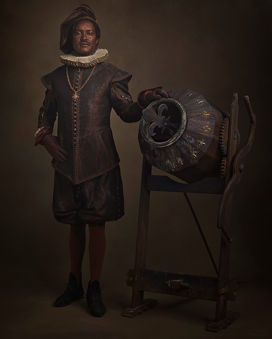 A man in Renaissance attire stands next to an ornate, antique machine, rendered in a style reminiscent of a classic oil painting.