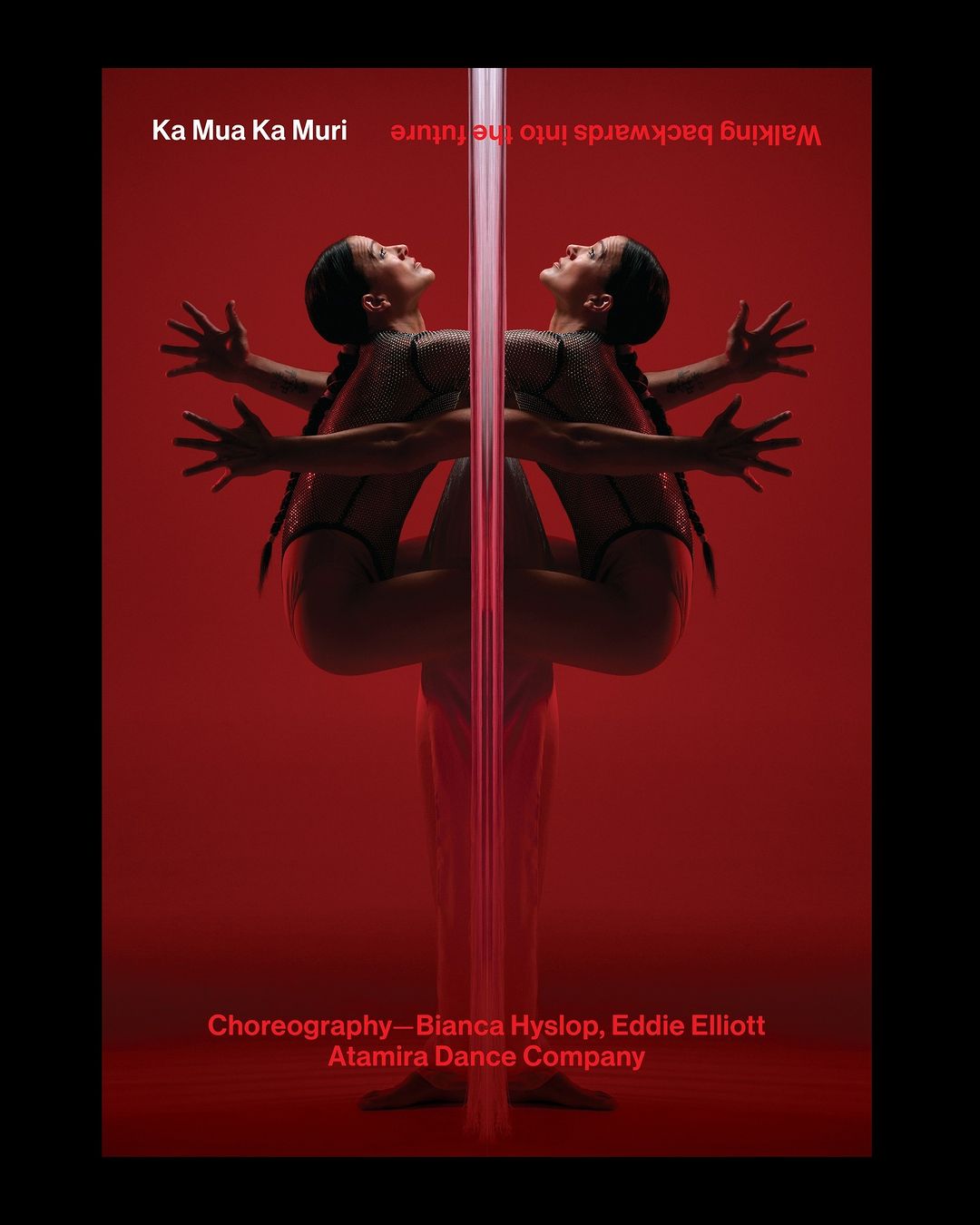 Artistic studio shot of a female dancer performing a pole routine in a red studio setting. The dancer is reflected off the pole.