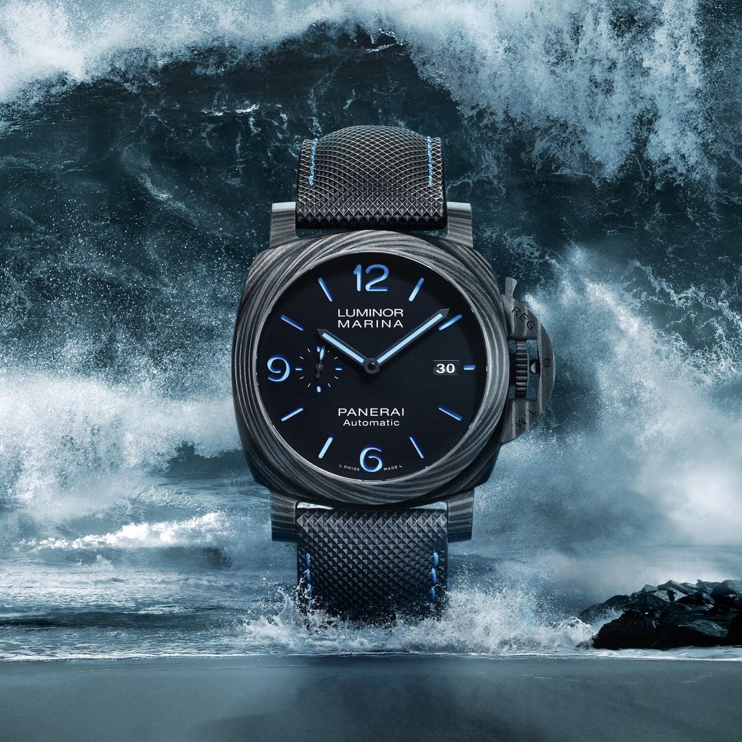 Luxury Panerai Luminor Marina watch floats above crashing ocean waves, blending elegance with nature's power, water, and blue tones.