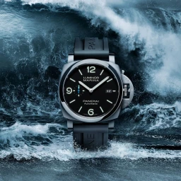Panerai Luminor Marina luxury watch featuring a black dial and rubber strap set against a crashing ocean wave background.