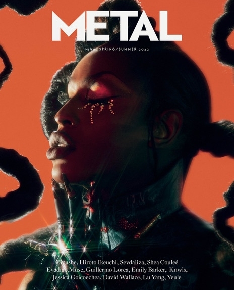 Metal Magazine cover featuring a model with embellished makeup and sculptural hair against an orange backdrop, text overlay.