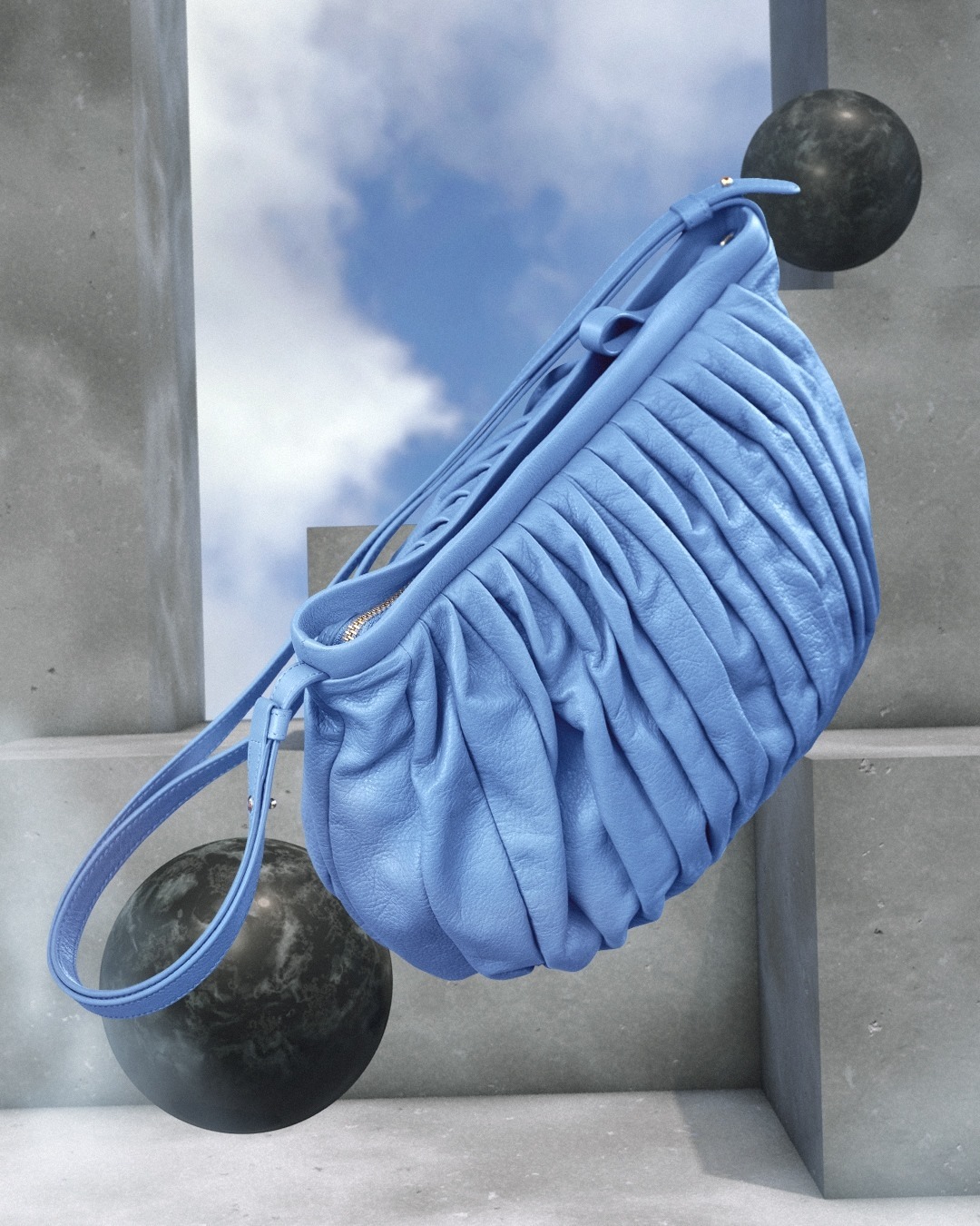 Fashion shot of a light-blue gathered shoulder bag, with rounded marble shapes and steps in the background against a blue sky.