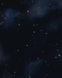 A deep night sky filled with scattered stars and faint dark clouds captured by photographer Sam Cannon.