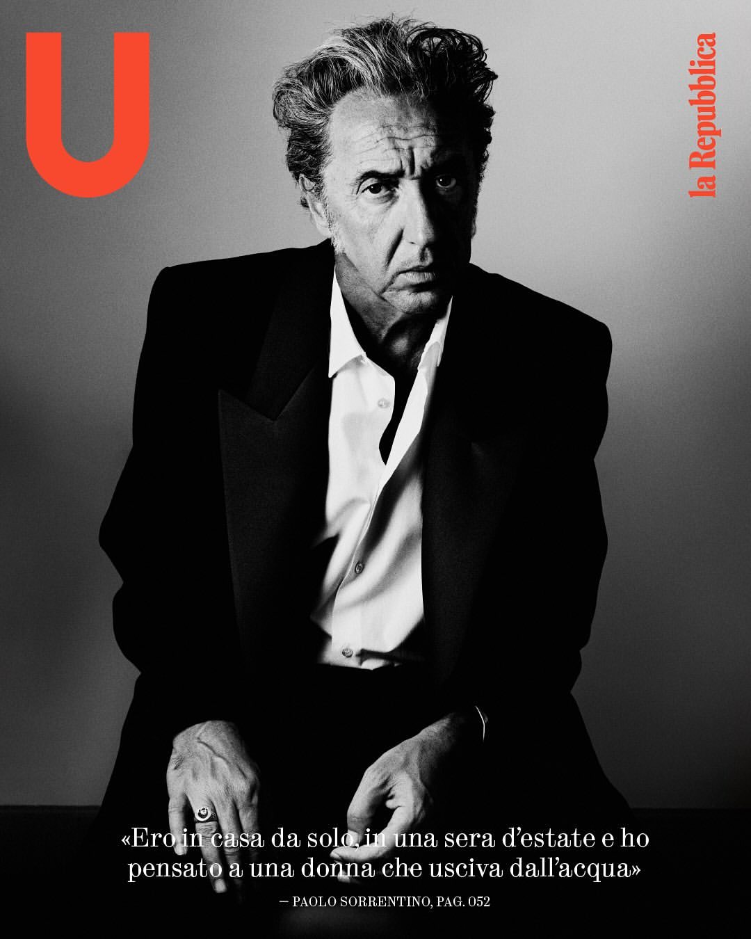 Black and white portrait of an adult male wearing a suit and sitting down, featured on the cover of la Repubblica magazine.