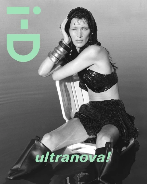 Magazine cover with a woman in a sequined outfit and boots sitting in water, featuring the i-D logo and the text 'ultranova!'