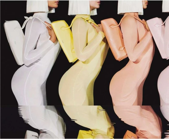 A fashion shot shows four women in pastel body suits and handbags, with their torsos and bags reflected against a black background.