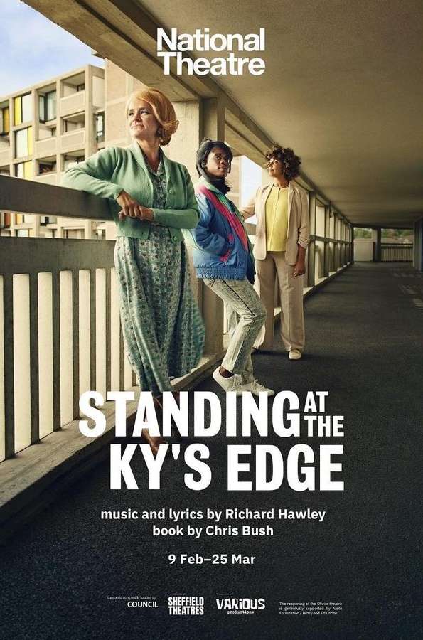 Three women stand on an elevated walkway, featuring a 'Standing at the Ky's Edge' poster with brutalist architecture backdrop.
